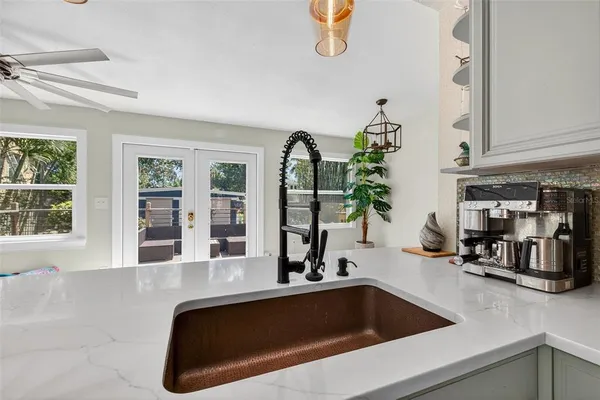 a kitchen with a sink and a window
