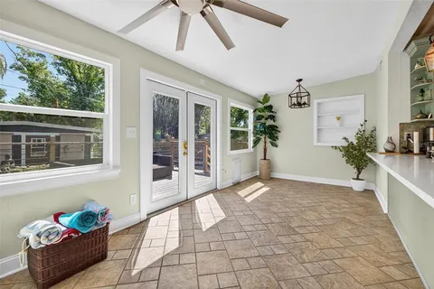 a view of an entryway with a flower garden