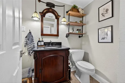 a view of a workspace with furniture and wooden floor