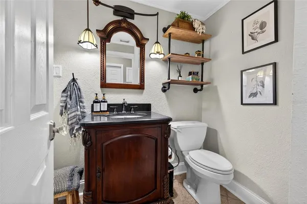 a view of a workspace with furniture and wooden floor