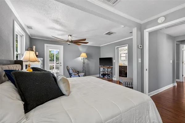 a bathroom with a toilet a sink a vanity and mirror