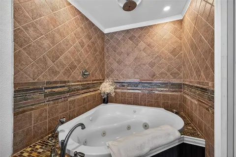 a kitchen with a sink a stove and a potted plant next to a window