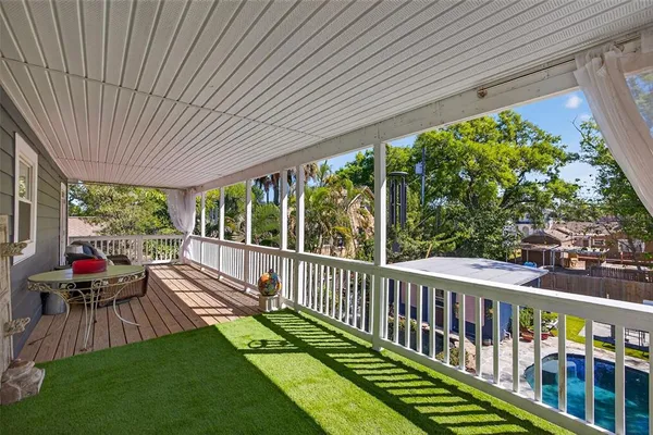 a view of a two chairs in the balcony