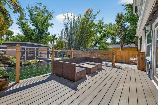 a backyard of a house with yard table and chairs