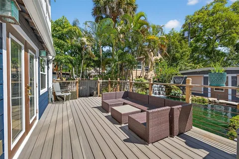 a swimming pool with outdoor seating and yard