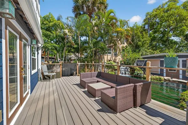 a swimming pool with outdoor seating and yard