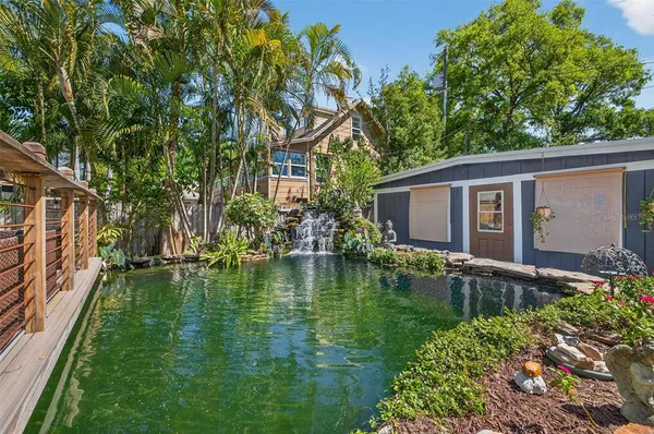 a swimming pool with outdoor seating yard and barbeque oven