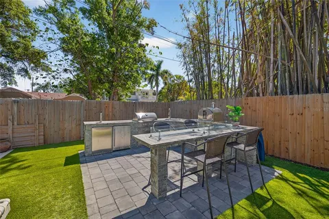 a front view of a house with a garden and porch