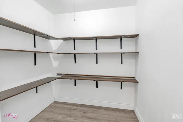 a view of a room with racks on the wall