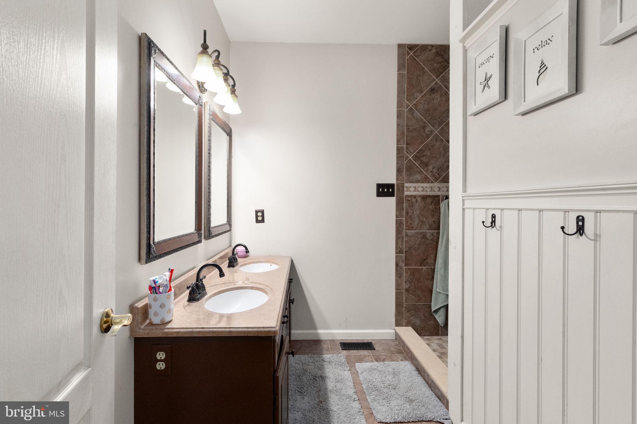 2140 Marston Road New Windsor, MD 21776 - Photo 20 of 48 a bathroom with a sink vanity and a mirror