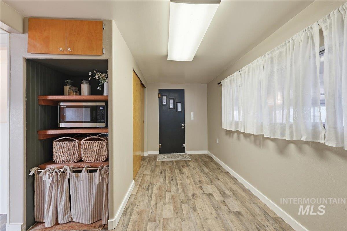 5405 Hogg Road Homedale, ID 83628 - Photo 16 of 29 Entryway featuring wood finished floors and baseboards