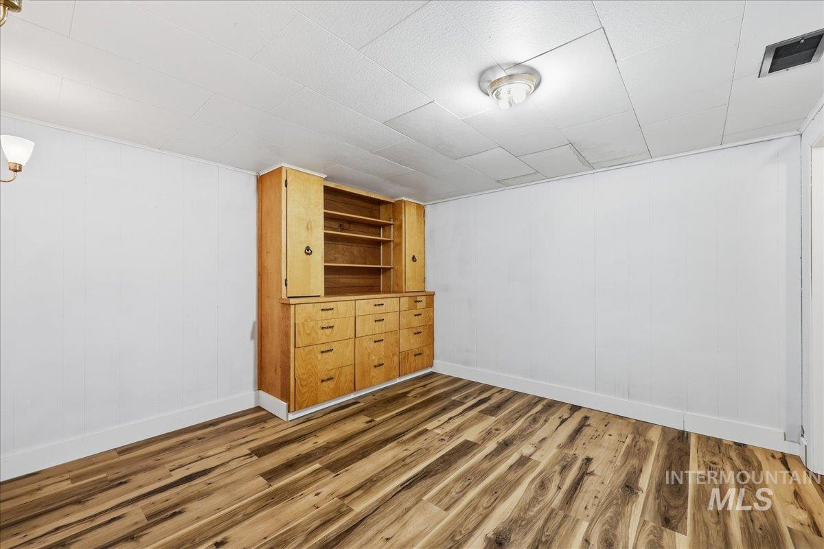 5405 Hogg Road Homedale, ID 83628 - Photo 20 of 29 Basement featuring wood walls and wood finished floors
