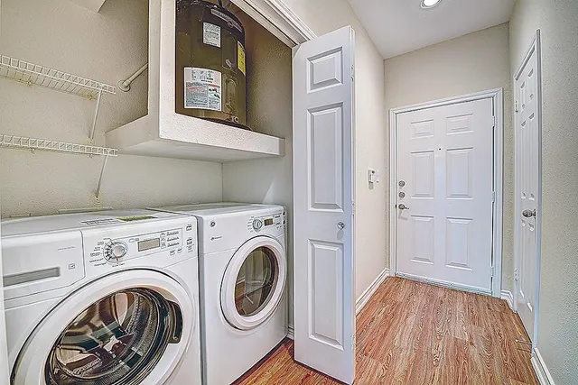 a view of storage and utility room with washer and dryer
