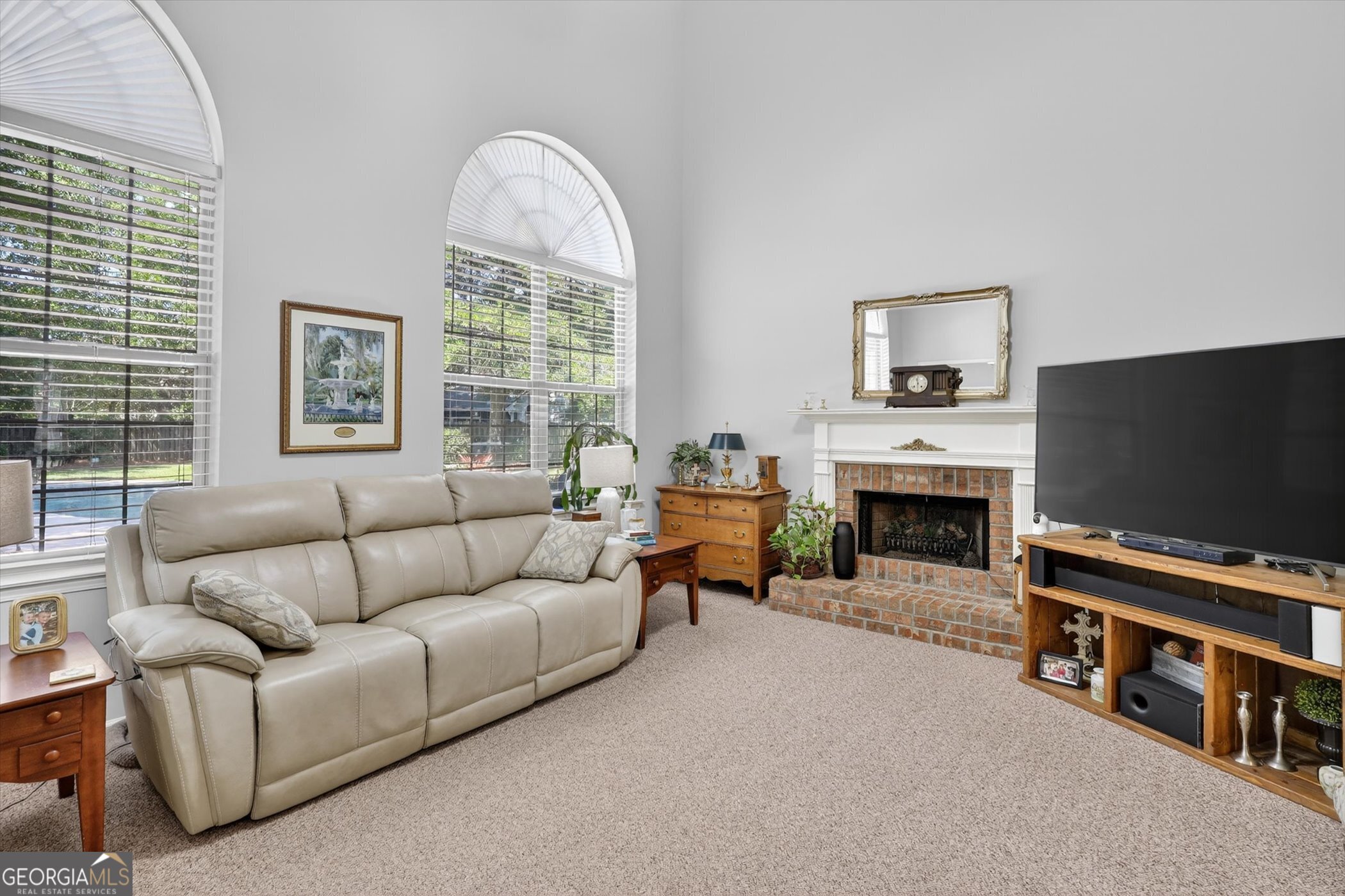 7 Towne Lake Court Pooler, GA 31322 - Photo 13 of 50 a living room with furniture a flat screen tv and a fireplace