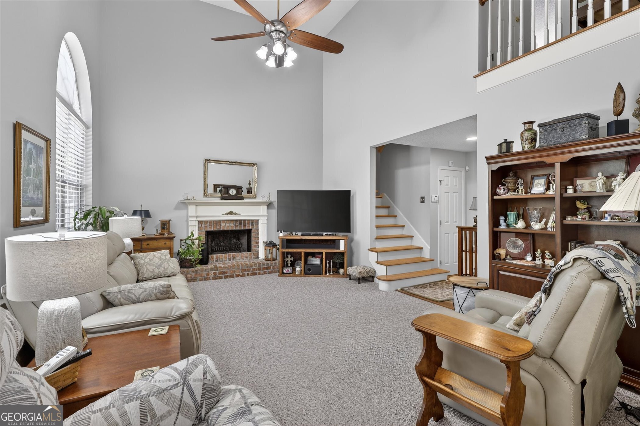 7 Towne Lake Court Pooler, GA 31322 - Photo 16 of 50 a living room with furniture a flat screen tv and a fireplace