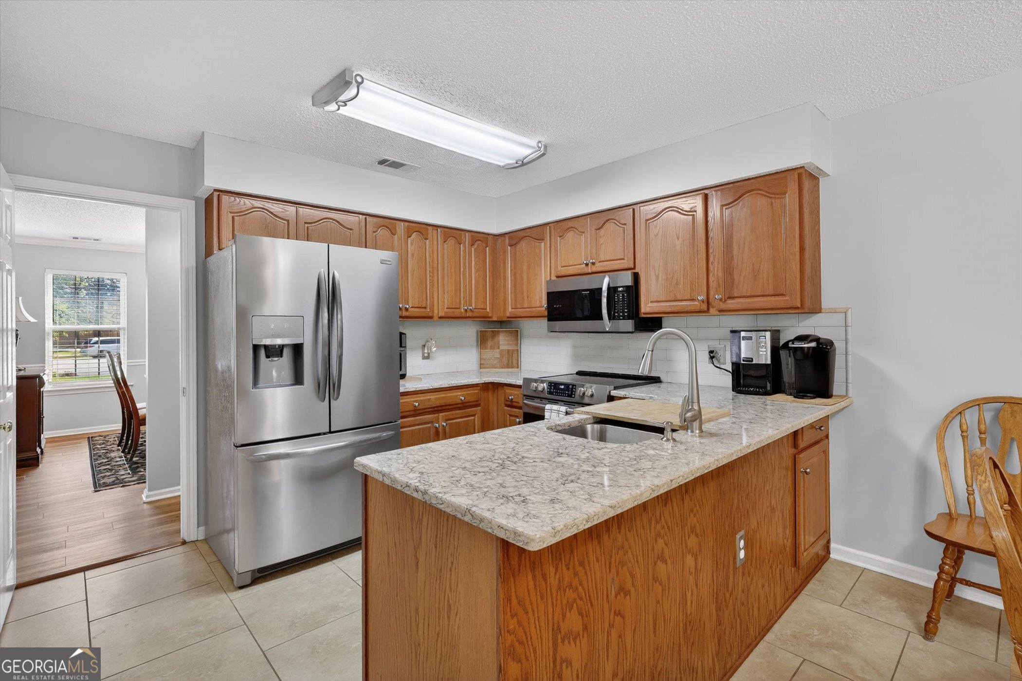 7 Towne Lake Court Pooler, GA 31322 - Photo 19 of 50 a kitchen with stainless steel appliances granite countertop a refrigerator stove microwave and sink