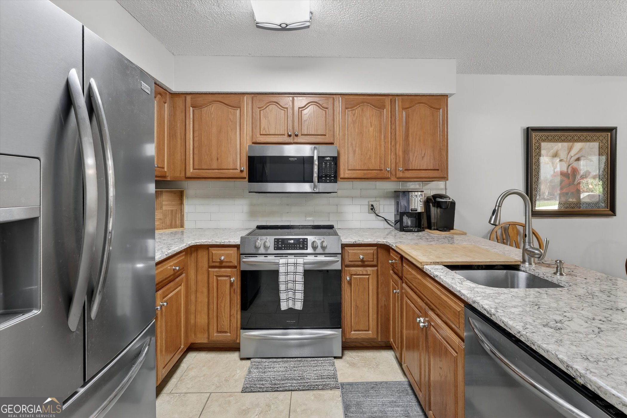 7 Towne Lake Court Pooler, GA 31322 - Photo 20 of 50 a kitchen with stainless steel appliances granite countertop a stove top oven a sink and dishwasher