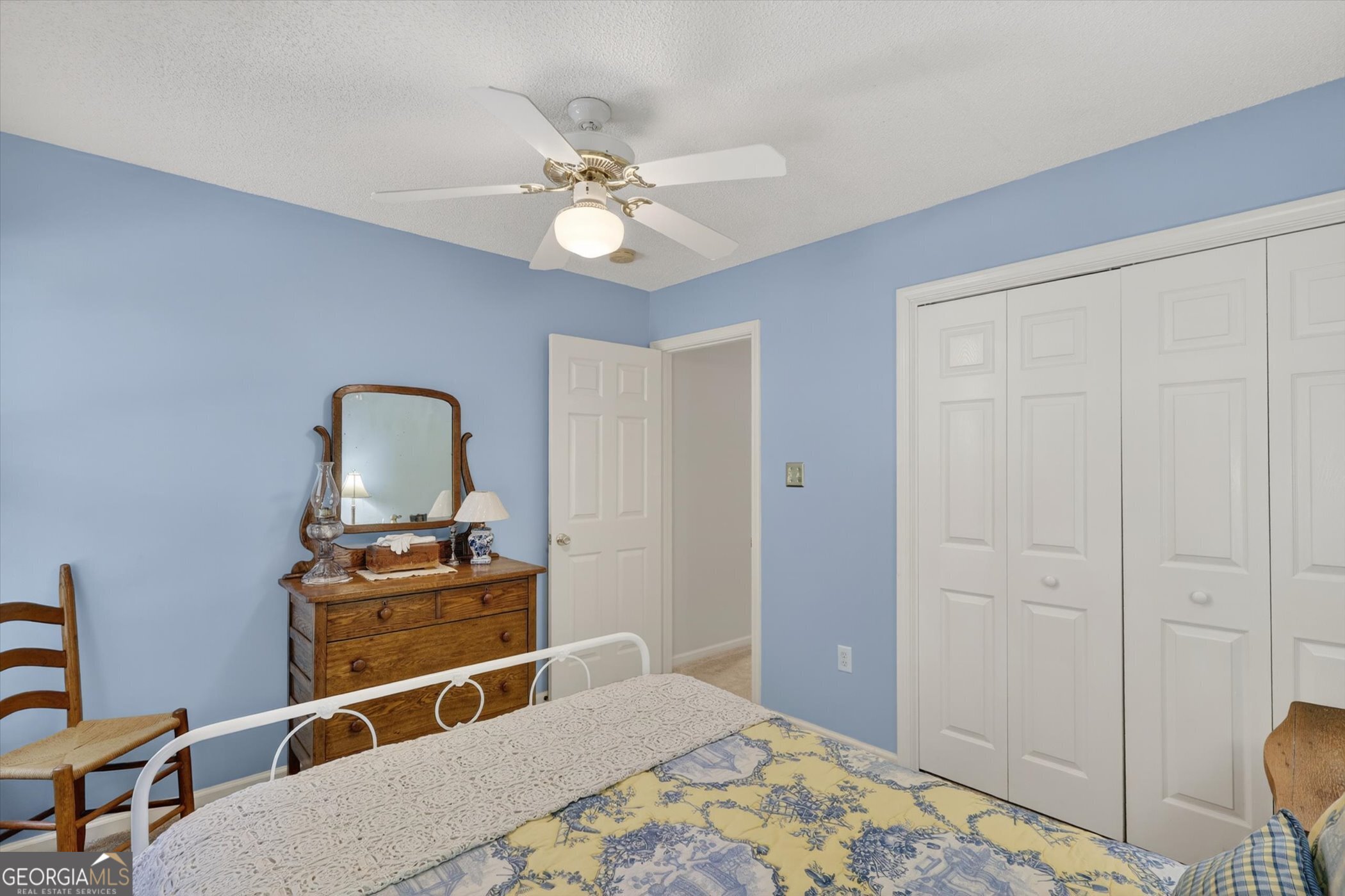 7 Towne Lake Court Pooler, GA 31322 - Photo 38 of 50 a bedroom with a bed and a chandelier