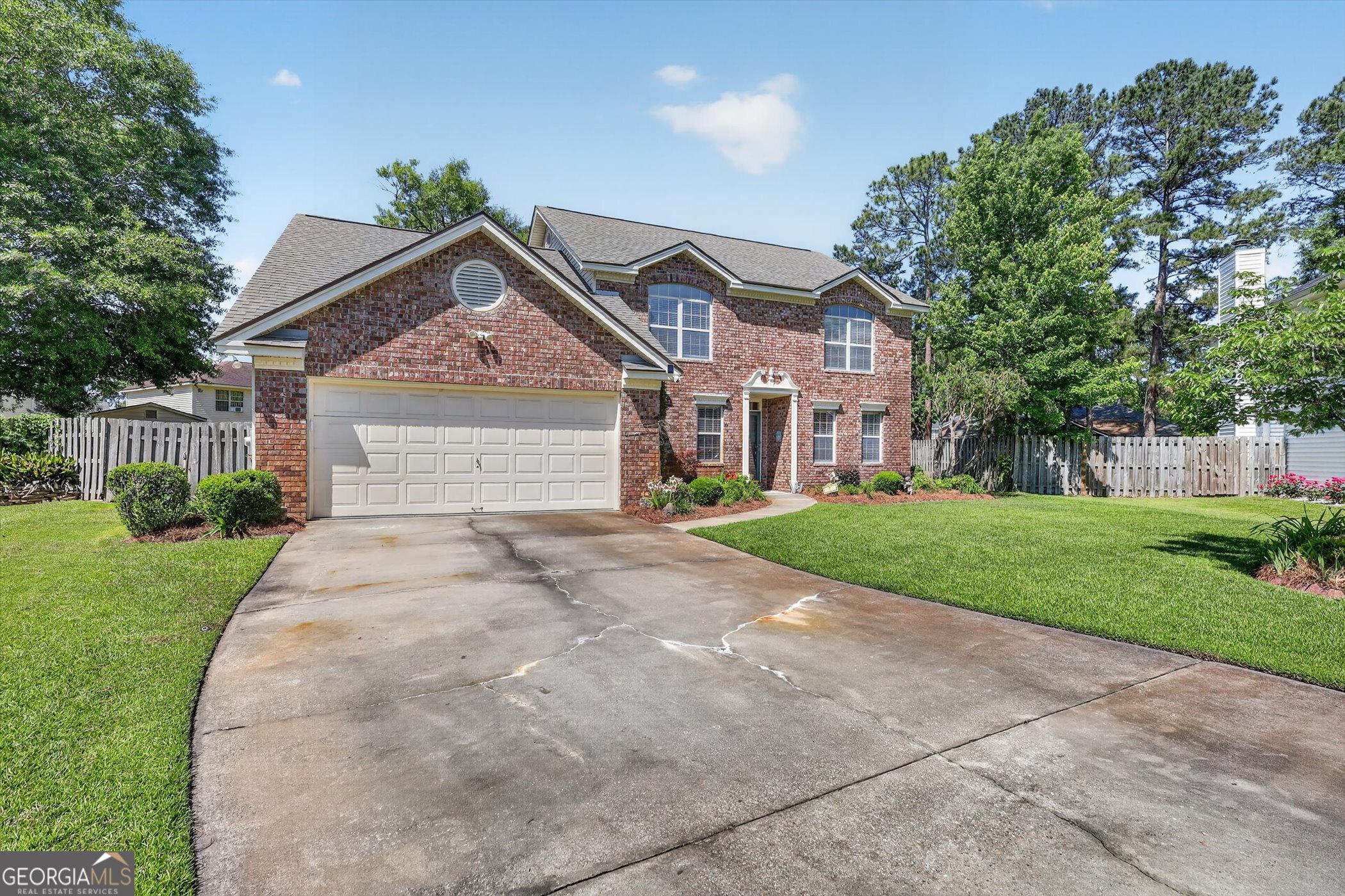 7 Towne Lake Court Pooler, GA 31322 - Photo 4 of 50 a front view of a house with a yard and garage