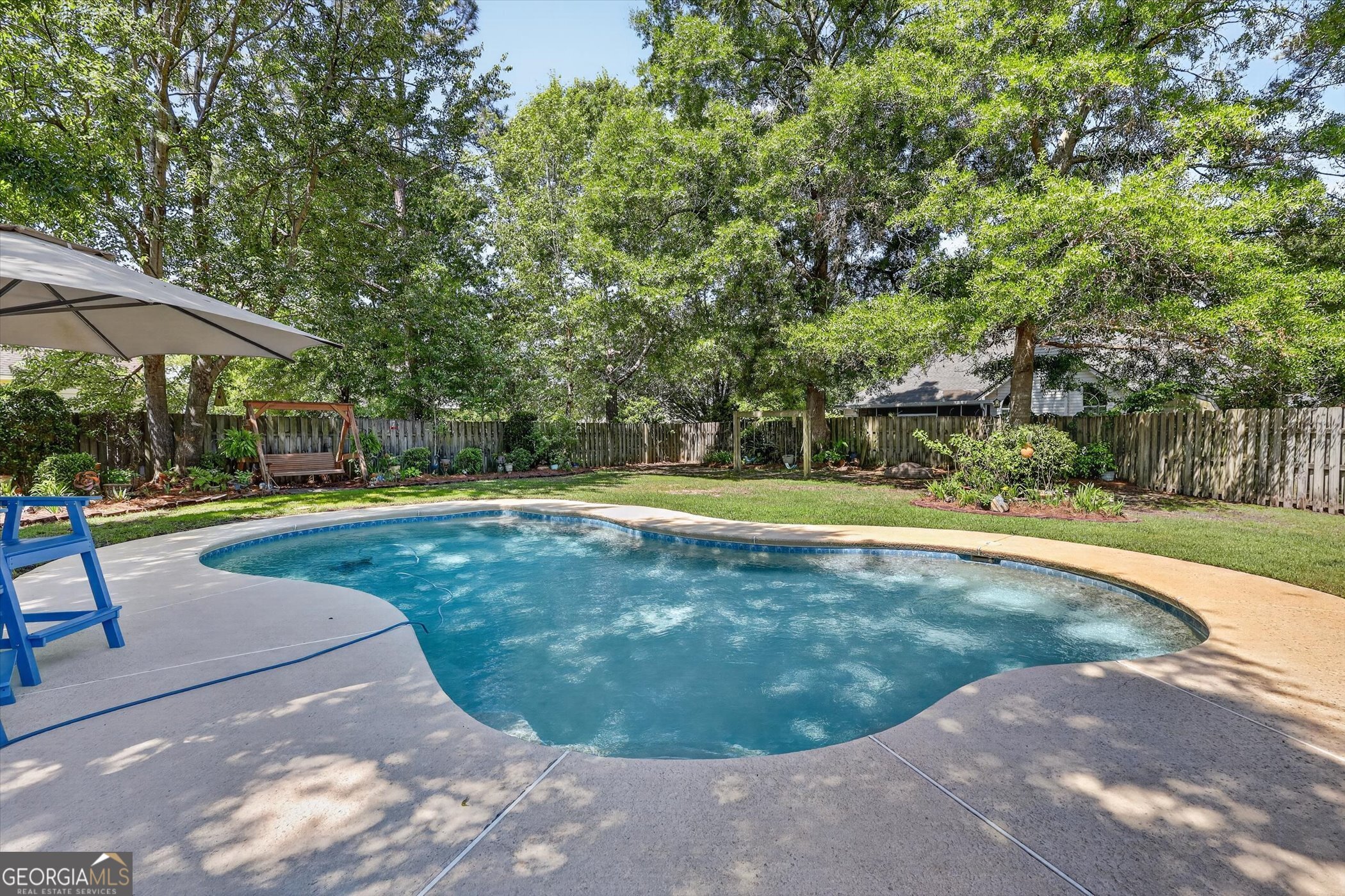 7 Towne Lake Court Pooler, GA 31322 - Photo 42 of 50 a view of a swimming pool with a patio
