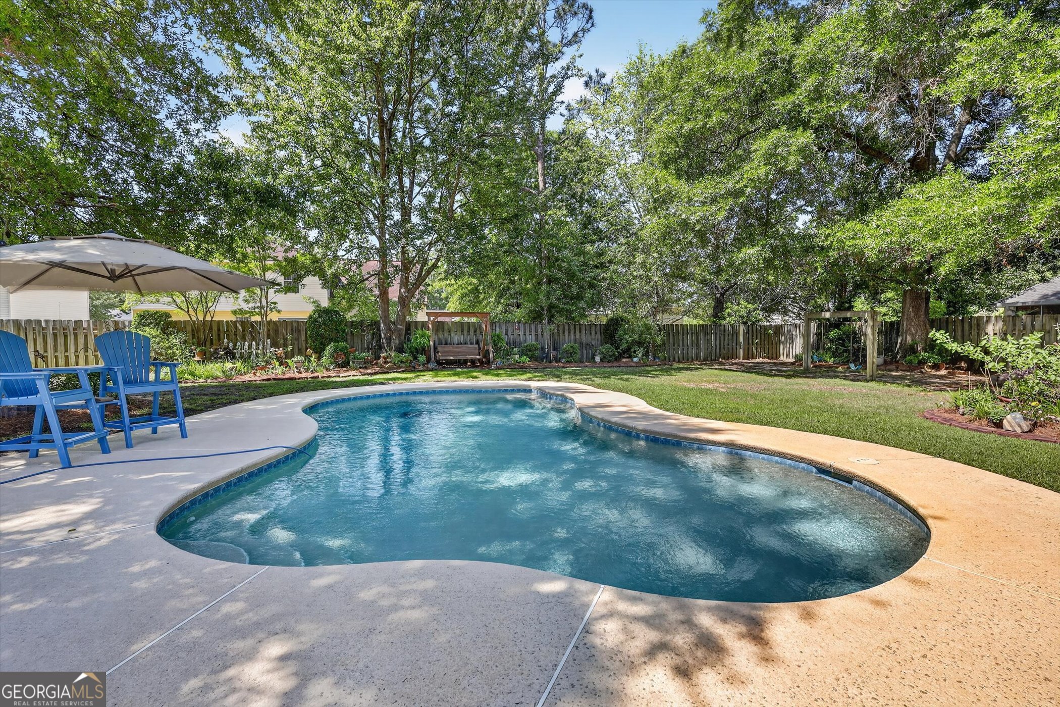 7 Towne Lake Court Pooler, GA 31322 - Photo 43 of 50 a view of a swimming pool with a sitting space