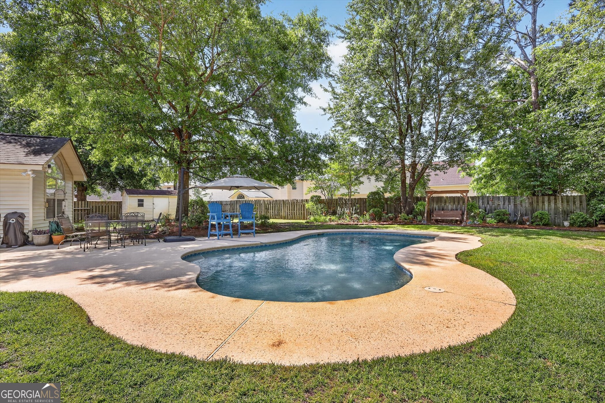 7 Towne Lake Court Pooler, GA 31322 - Photo 44 of 50 a view of a swimming pool with a patio