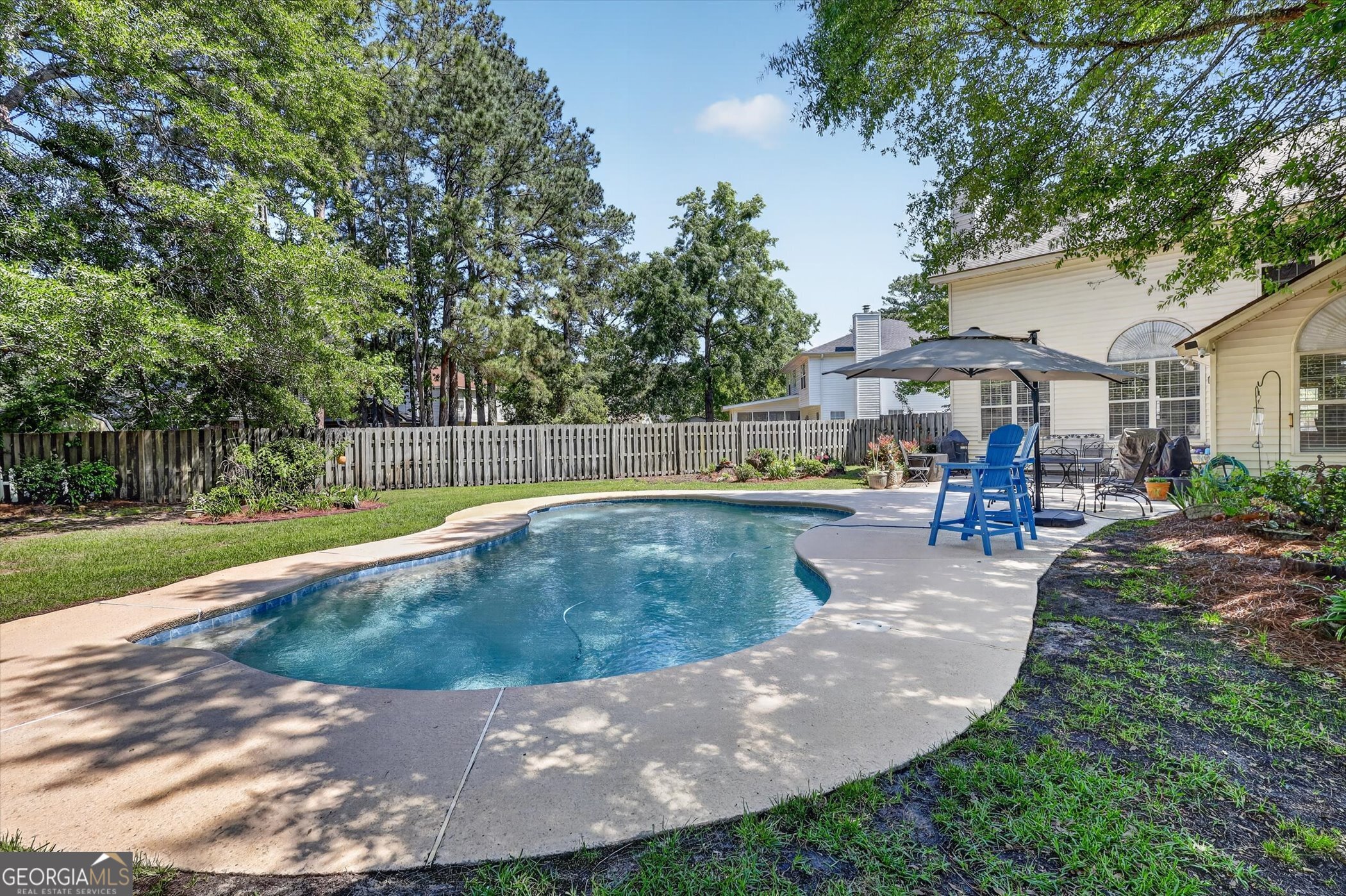7 Towne Lake Court Pooler, GA 31322 - Photo 49 of 50 a view of a swimming pool with a patio