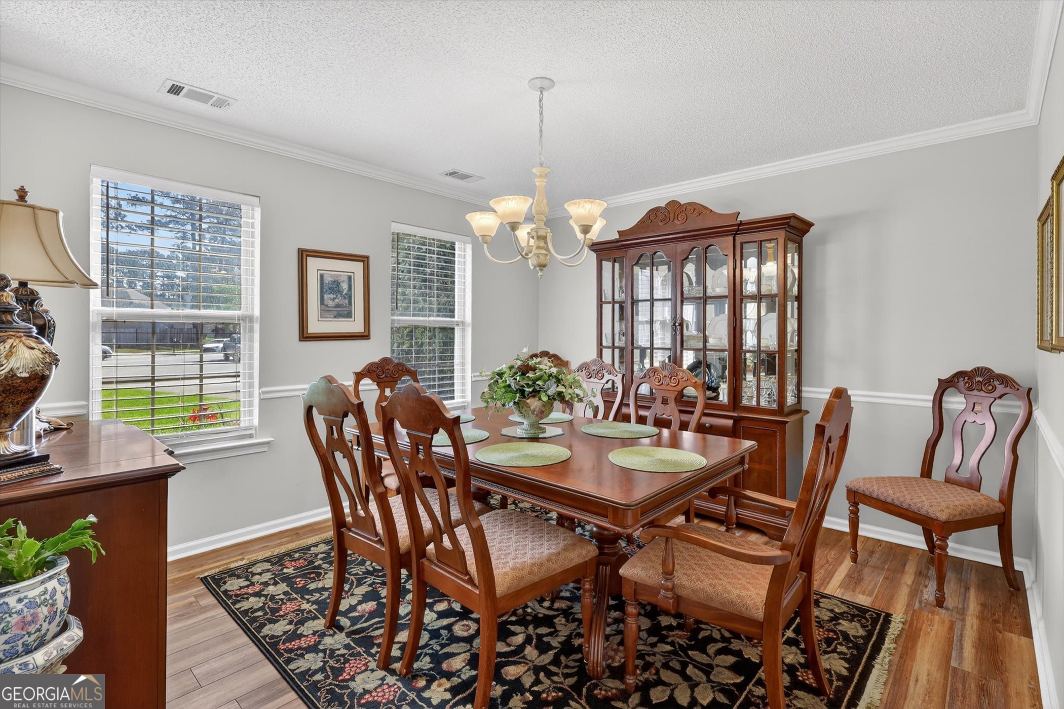 7 Towne Lake Court Pooler, GA 31322 - Photo 9 of 50 a dining room with furniture a chandelier and wooden floor