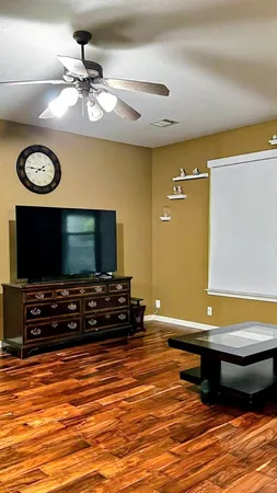 a room with pool table and a flat screen tv
