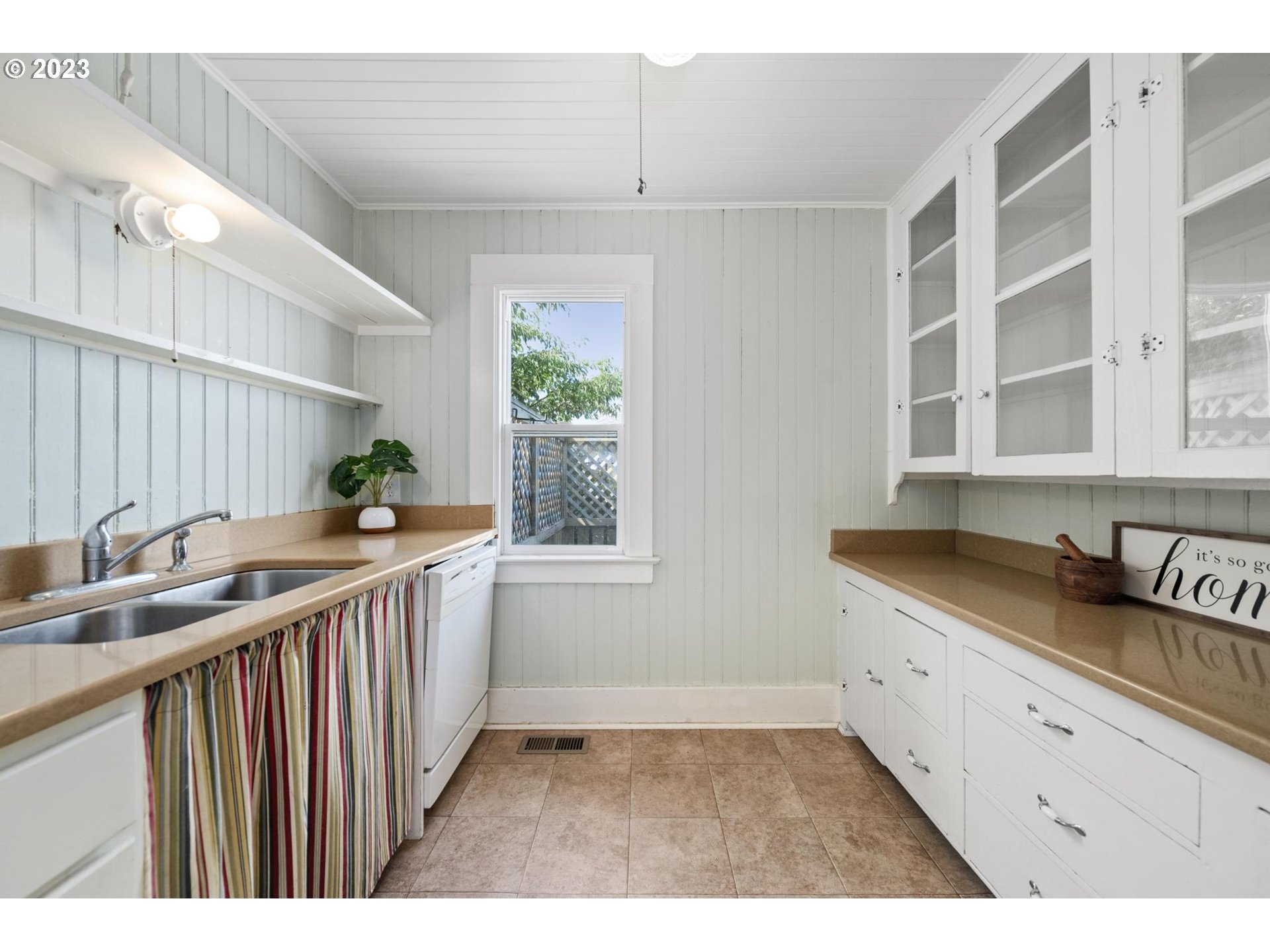 531 35th Street Astoria, OR 97103 - Photo 13 of 37 a kitchen with a sink and cabinets