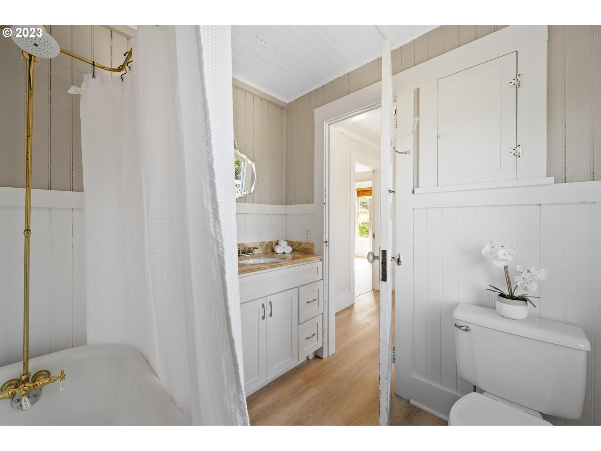 531 35th Street Astoria, OR 97103 - Photo 17 of 37 a bathroom with a sink and a mirror