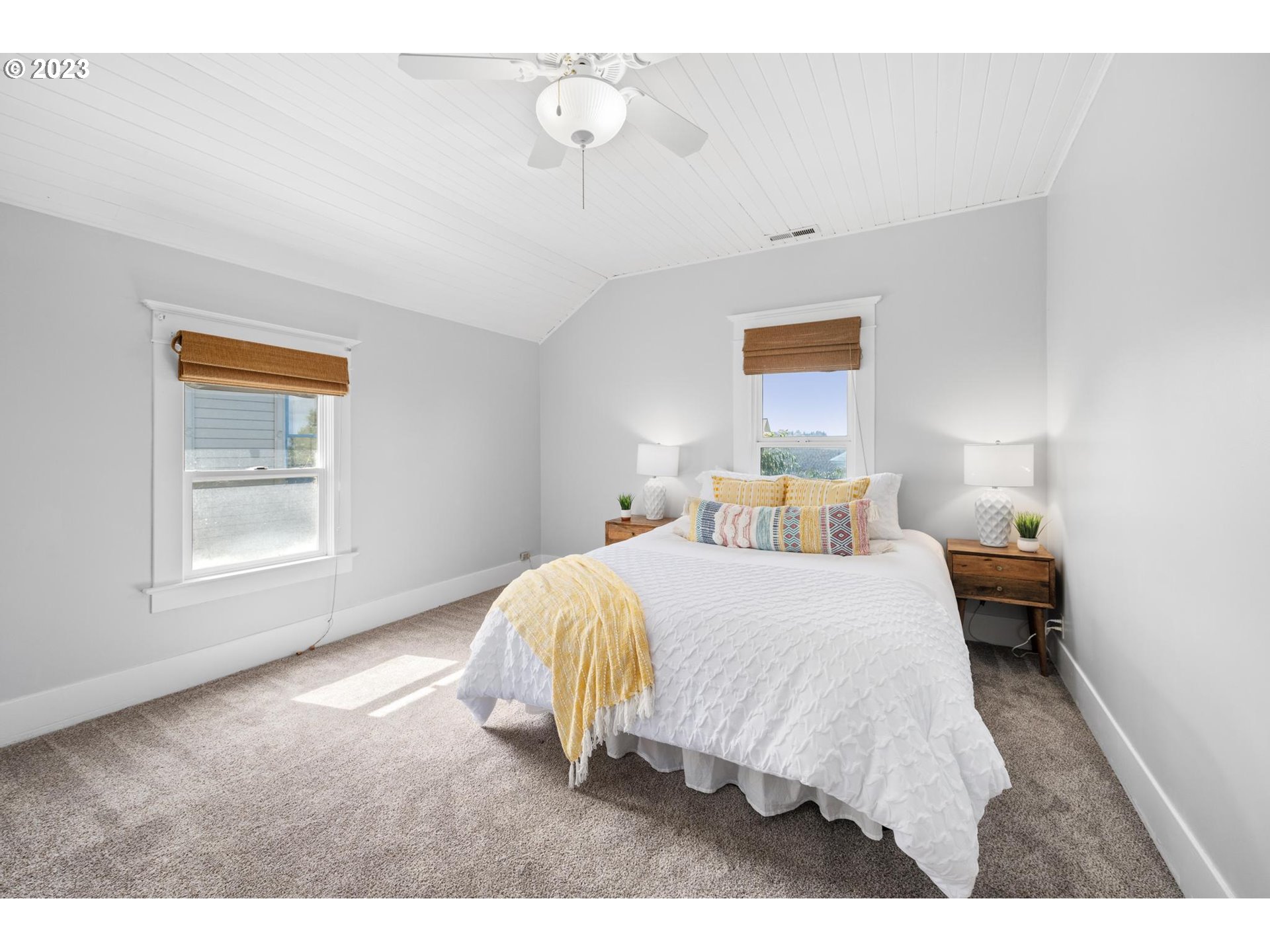 531 35th Street Astoria, OR 97103 - Photo 18 of 37 a bedroom with a bed and a window