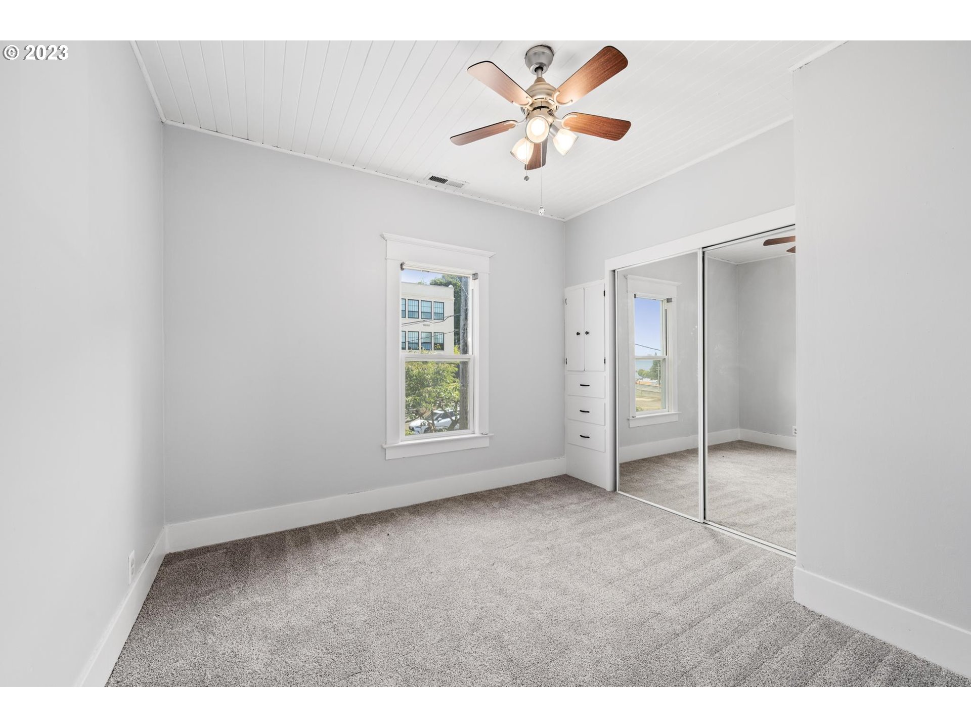 531 35th Street Astoria, OR 97103 - Photo 21 of 37 a view of an empty room with a window