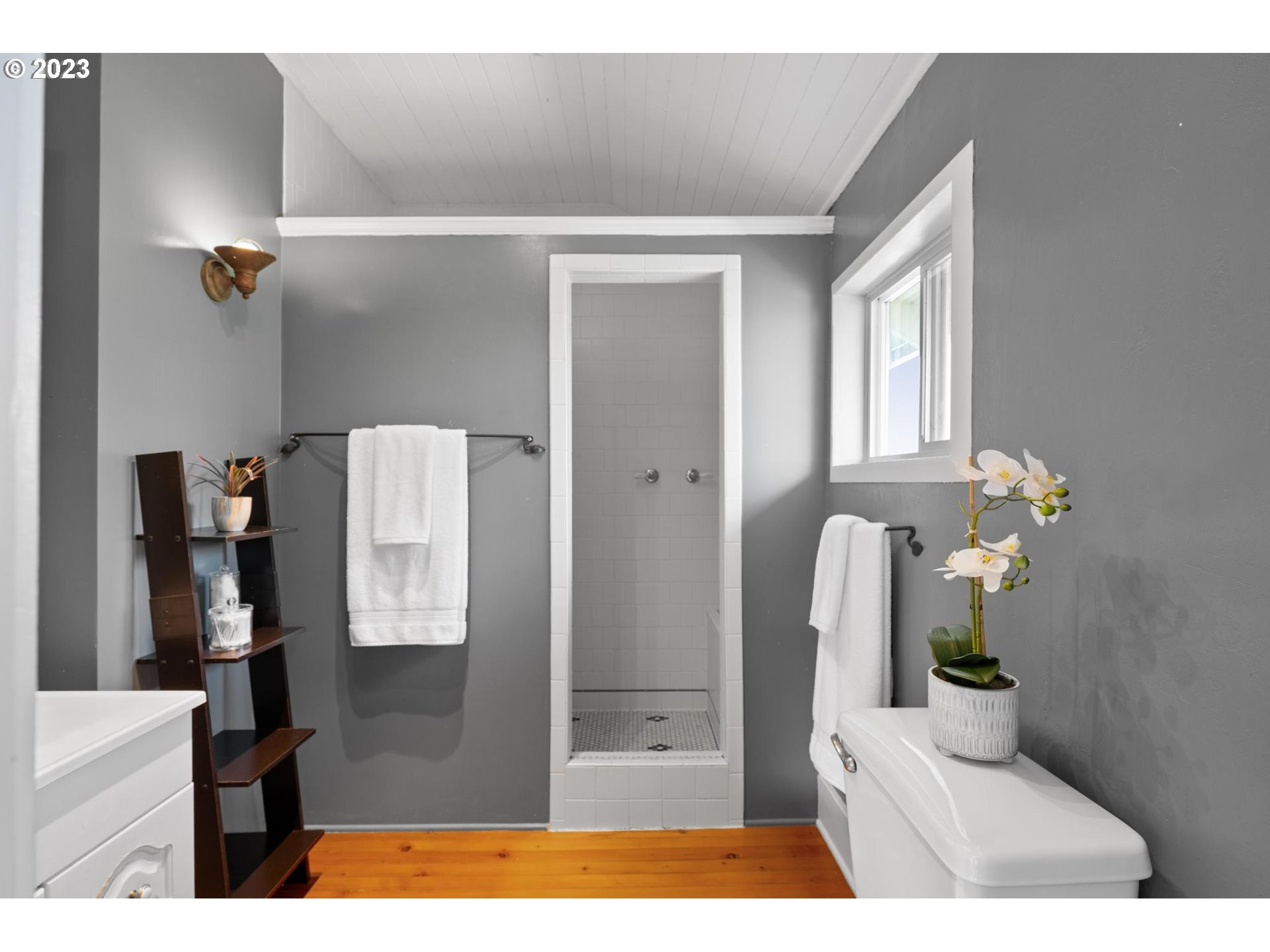531 35th Street Astoria, OR 97103 - Photo 25 of 37 a bathroom with a sink and a mirror