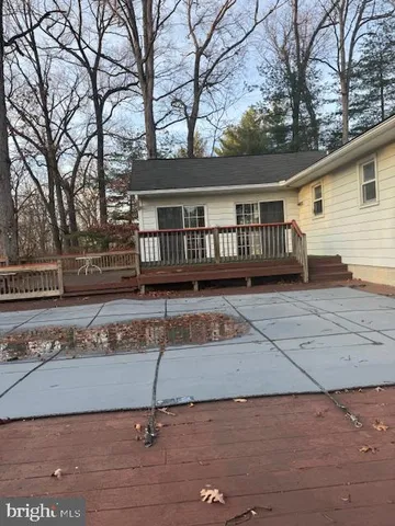 front view of a house with a bench