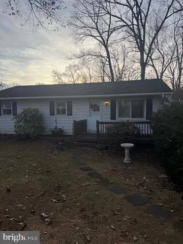 a house view with a backyard space