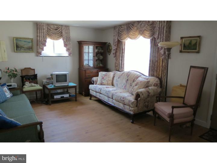 950 Chesterfield Road Barrington, NJ 08033 - Photo 3 of 14 a living room with furniture and a flat screen tv