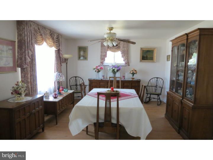 950 Chesterfield Road Barrington, NJ 08033 - Photo 5 of 14 a living room with furniture a chandelier and a window