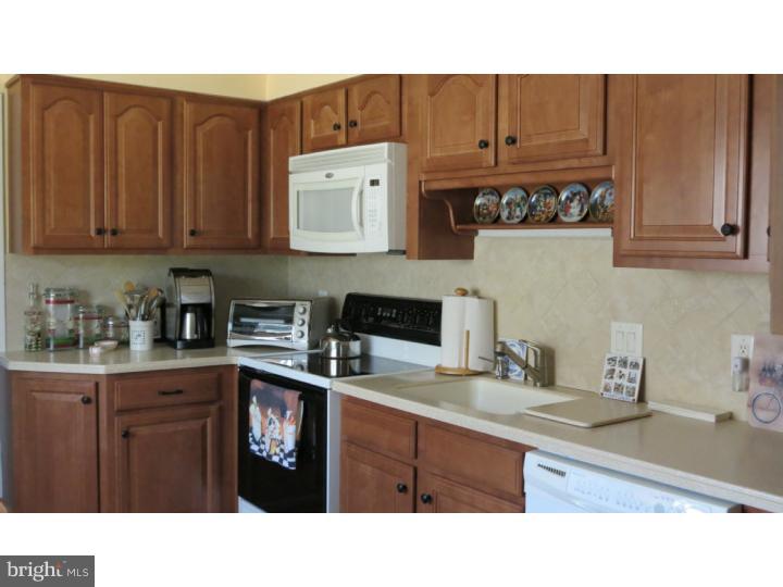 950 Chesterfield Road Barrington, NJ 08033 - Photo 6 of 14 a kitchen with a sink cabinets and window