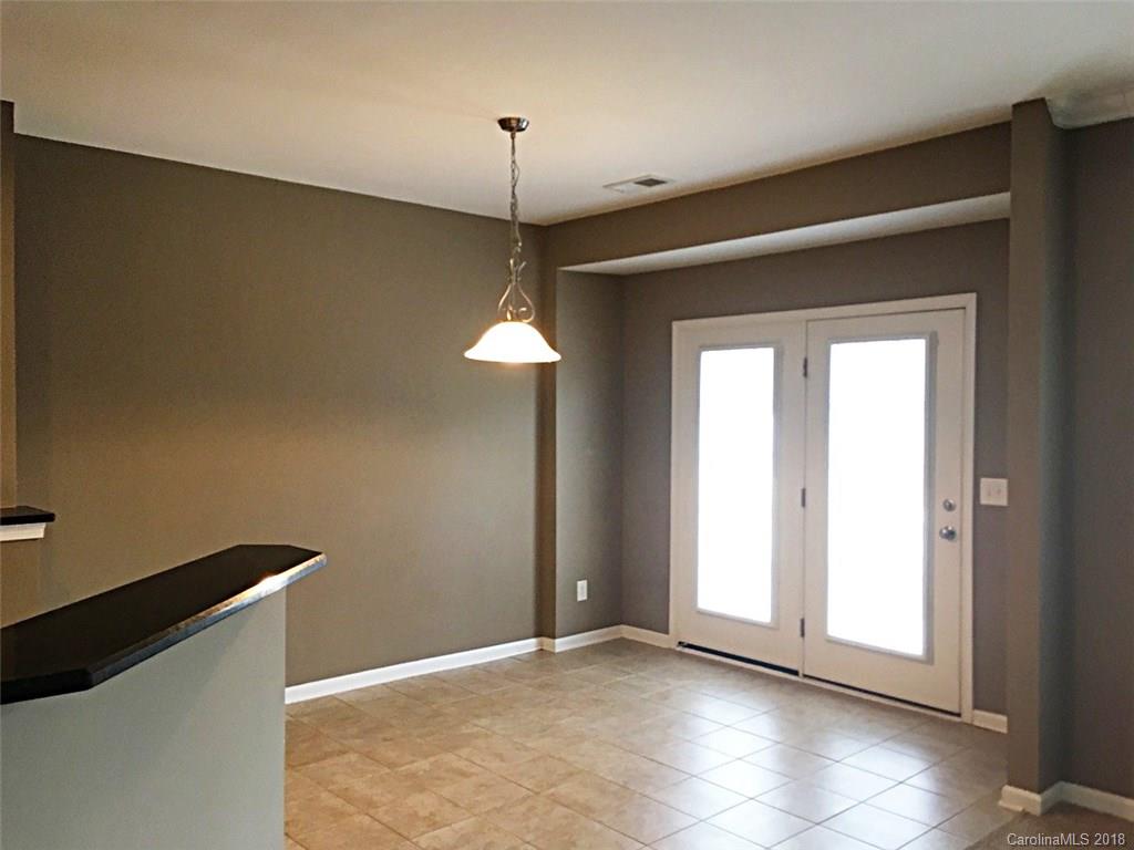 751 Prospect Lane, Unit 37 Fort Mill, SC 29708 - Photo 4 of 12 a view of an empty room with a window