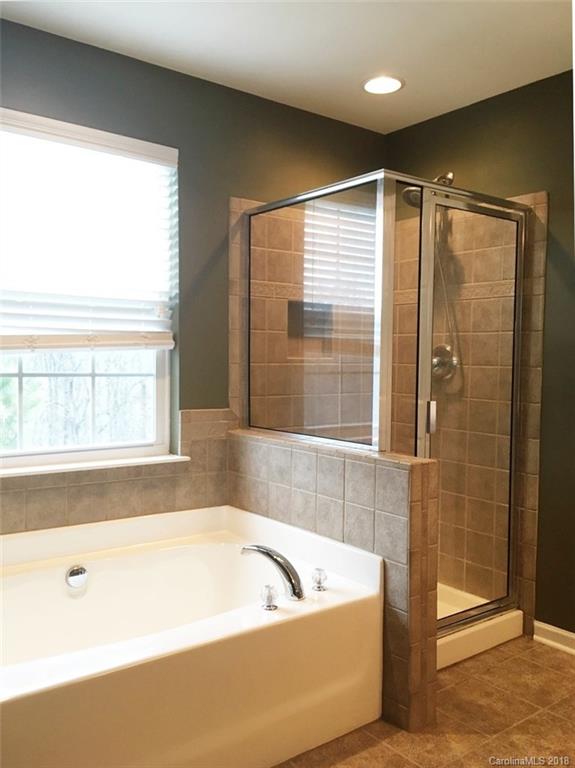 751 Prospect Lane, Unit 37 Fort Mill, SC 29708 - Photo 8 of 12 a bathroom with a bathtub and shower