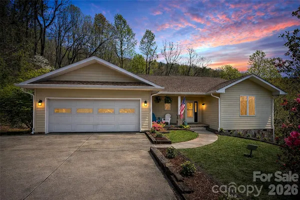a front view of a house with yard