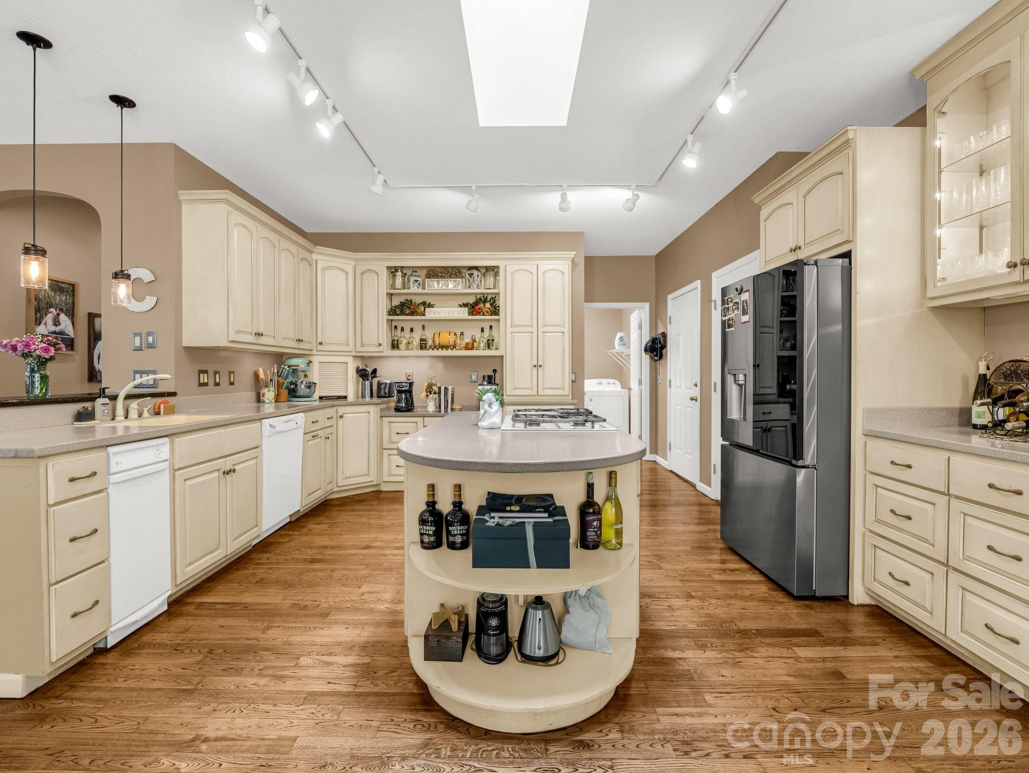 1424 Wolf Pen Road Old Fort, NC 28762 - Photo 11 of 45 a large kitchen with kitchen island a large counter top stainless steel appliances and cabinets