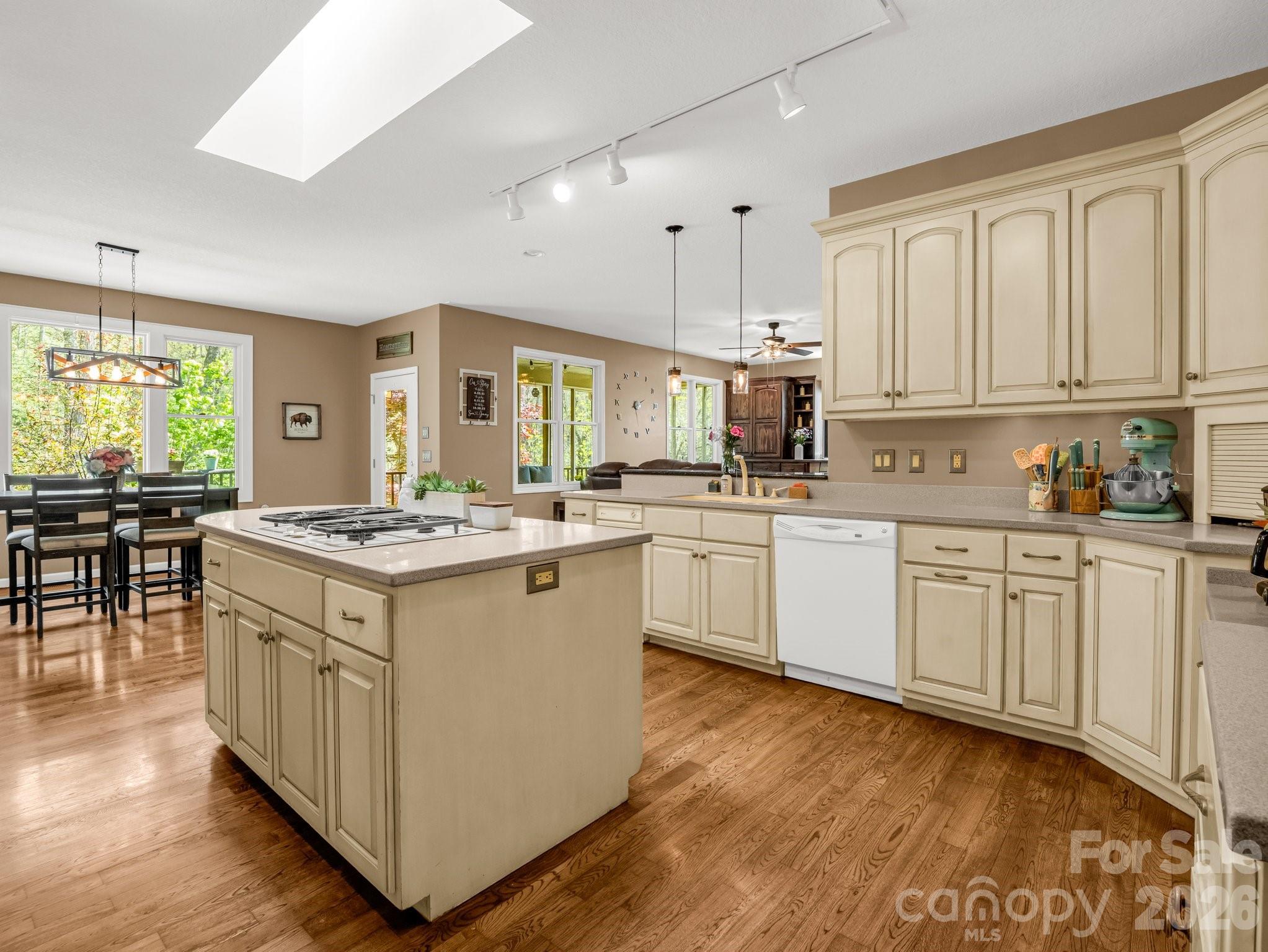 1424 Wolf Pen Road Old Fort, NC 28762 - Photo 13 of 45 a kitchen with a sink stove and cabinets