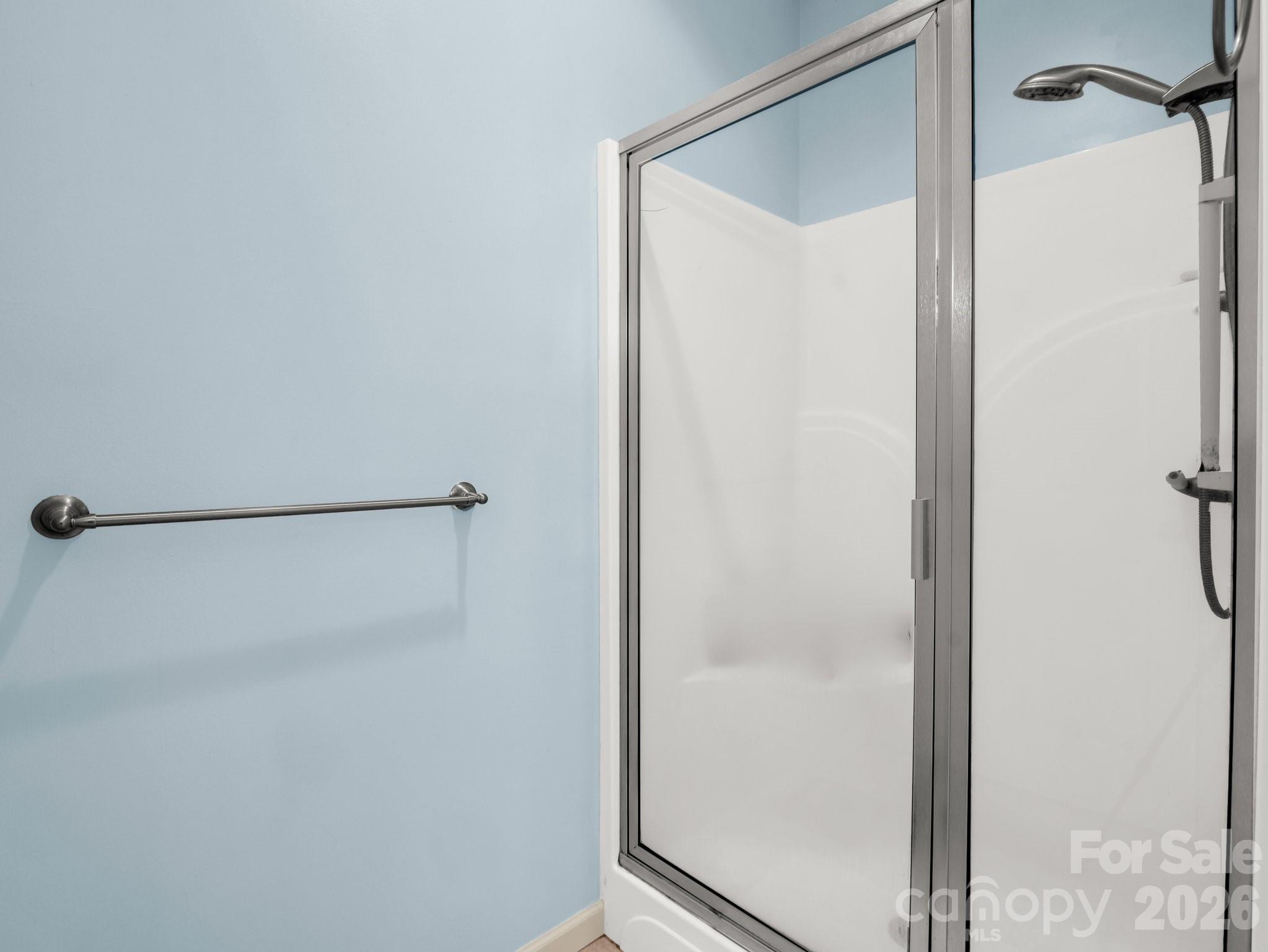 1424 Wolf Pen Road Old Fort, NC 28762 - Photo 19 of 45 a bathroom with a glass shower door