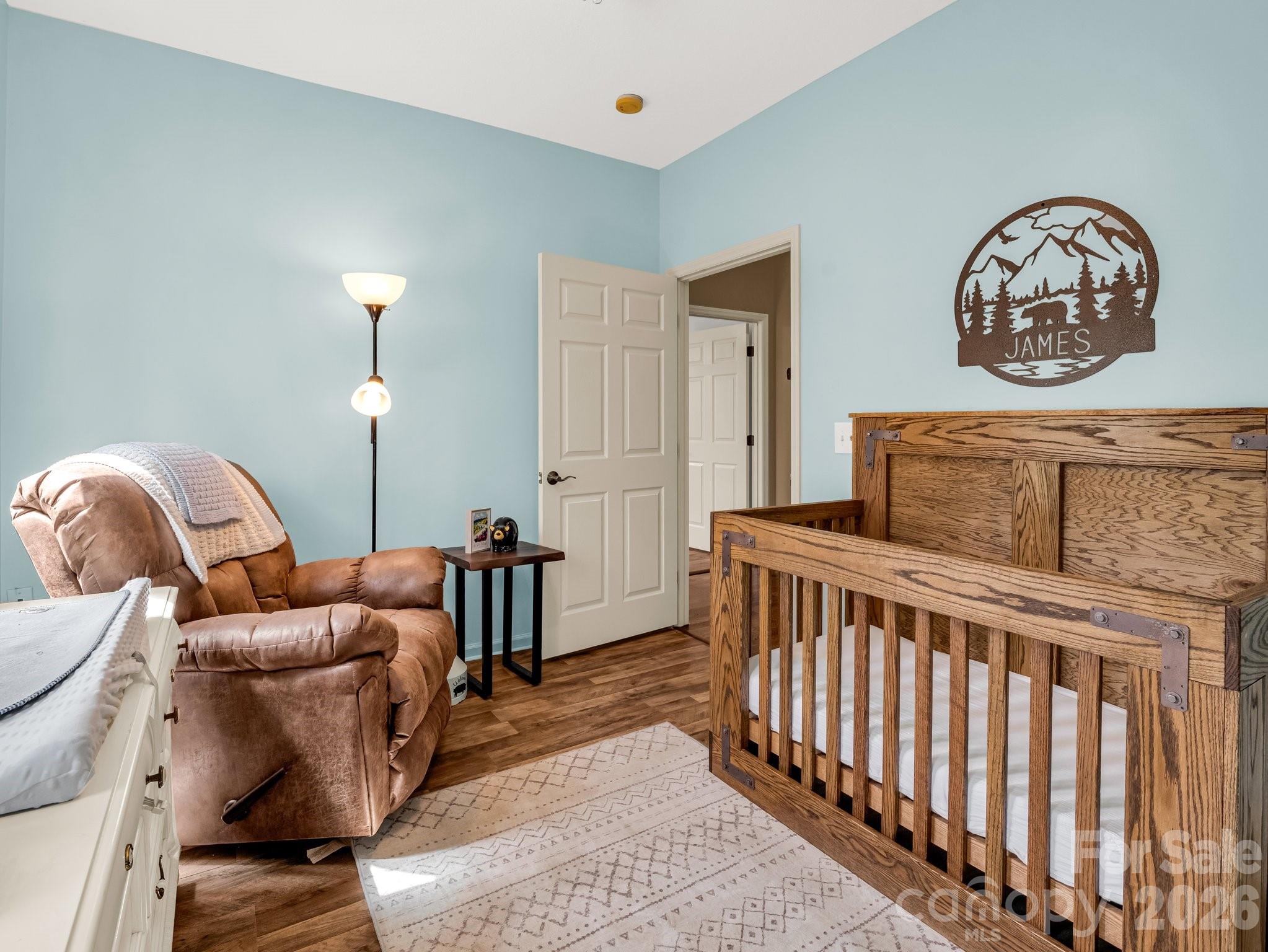 1424 Wolf Pen Road Old Fort, NC 28762 - Photo 25 of 45 a bedroom with furniture and a window