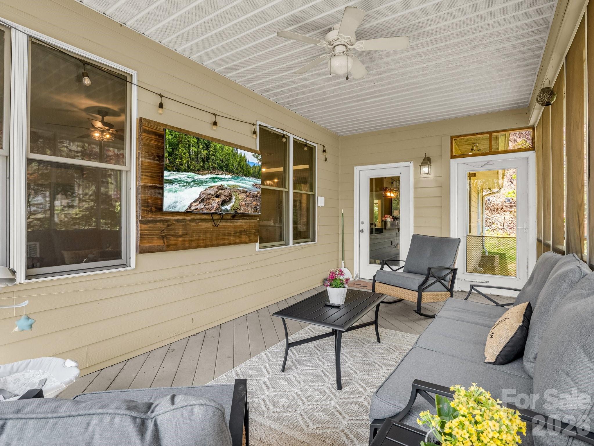 1424 Wolf Pen Road Old Fort, NC 28762 - Photo 28 of 45 a living room with furniture and a large window