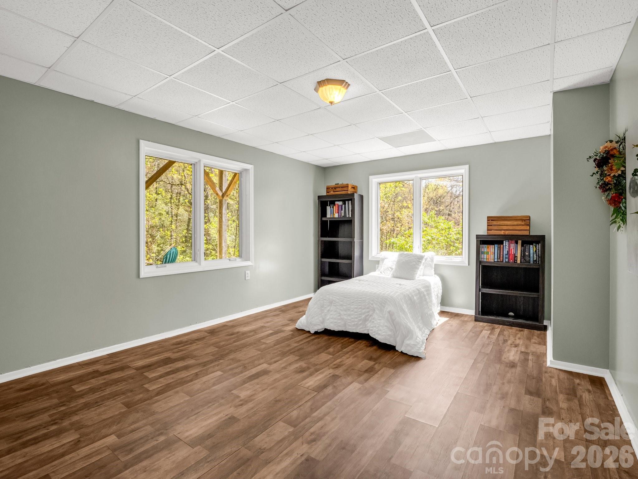 1424 Wolf Pen Road Old Fort, NC 28762 - Photo 29 of 45 a bedroom with a bed and a window