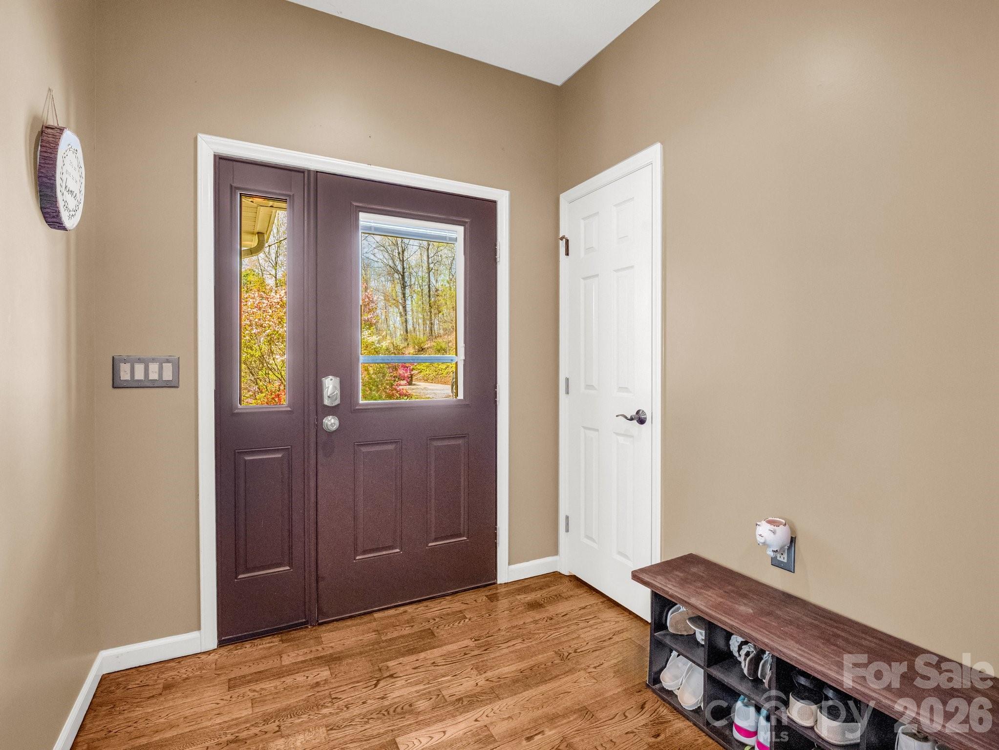 1424 Wolf Pen Road Old Fort, NC 28762 - Photo 3 of 45 a bedroom with a bed and wooden floor