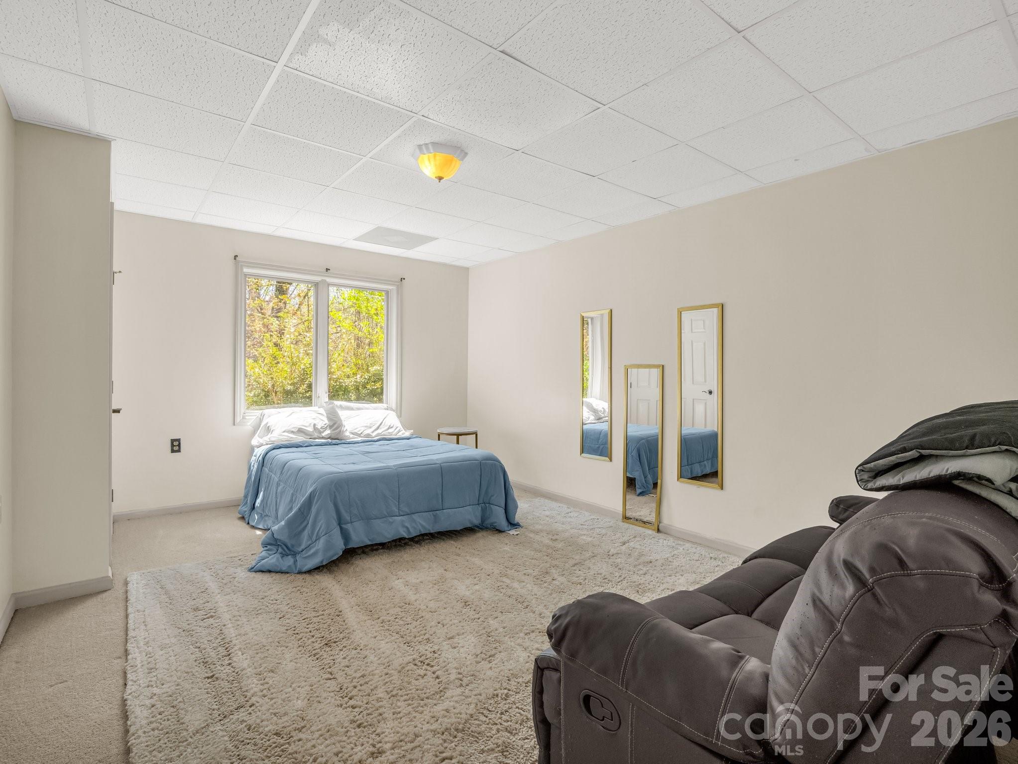 1424 Wolf Pen Road Old Fort, NC 28762 - Photo 32 of 45 a bedroom with a bed and window